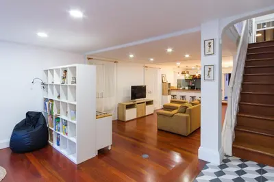 a living room with a stair case and a living room at GuestReady - Peaceful haven in Funchal in Funchal
