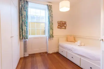 a bedroom with a bed and a window at GuestReady - Peaceful haven in Funchal in Funchal