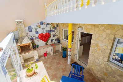 an overhead view of a house with a heart on the wall at Casa Colorida in Vila do Bispo