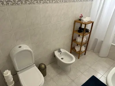 a bathroom with a toilet and a bidet at Refúgio dos Prazeres - Madeira Inn Group in Prazeres