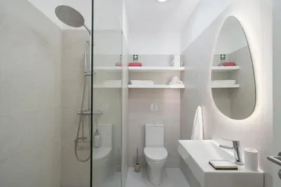 a bathroom with a shower and a toilet and a sink at Apartamento Jaime Moniz by An Island Apart in Funchal