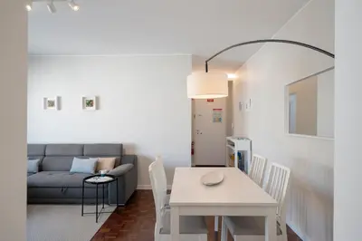 a living room with a table and a couch at Apartamento Jaime Moniz by An Island Apart in Funchal