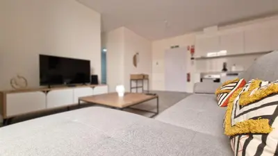 a living room with a couch and a table at Carmo City Palace by LovelyStay in Funchal