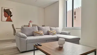 a living room with a couch and a table at Carmo City Palace by LovelyStay in Funchal