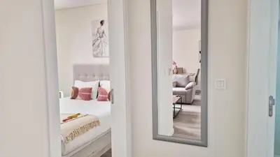 a mirror in a bedroom with a bed at Carmo City Palace by LovelyStay in Funchal
