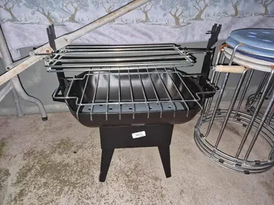 a grill sitting on a stand in a room at House in Camara de Lobos in Estreito de Câmara de Lobos