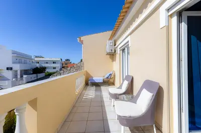 a stone building with potted plants in front of it at Villa Arpeggio - Cozy 3-Bedroom Villa with Private Pool in Montinhos da Luz, Lagos in Mato Porcas