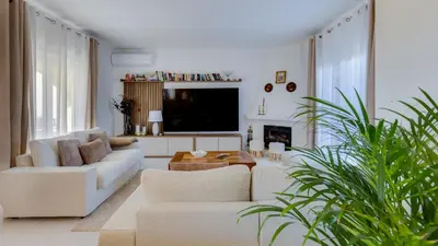 a living room with two couches and a tv at Villa Arpeggio - Cozy 3-Bedroom Villa with Private Pool in Montinhos da Luz, Lagos in Mato Porcas