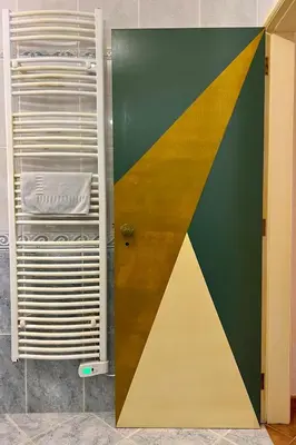 a room with a door with a colorful wall at Private renovated APT w pool, 3m to praia da Luz in Valverde