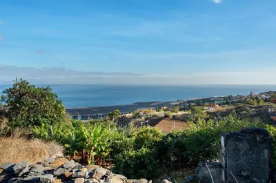 a view of the ocean from the top of a hill at Refugio Dourado in Água de Pena