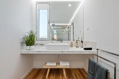 a bathroom with a sink and a mirror at Diogo House - view Funchal in Funchal