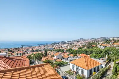 a view of a city with roofs at Diogo House - view Funchal in Funchal