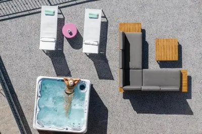 an overhead view of a dog in a swimming pool at Casa de Pedra by An Island Apart in Ribeira Brava