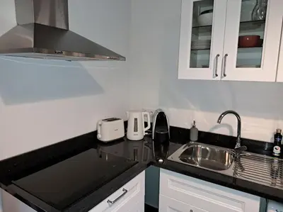 a bathroom with a toilet and a sink and a shower at Casa da Marica in São Vicente