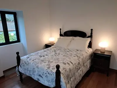 a mirror on top of a table in a room at Casa da Vicencia in São Vicente