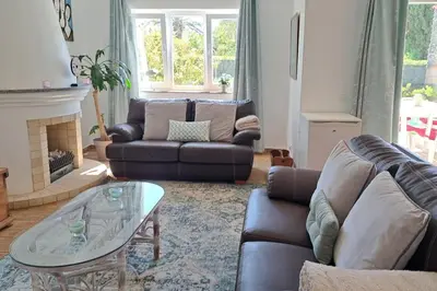 a living room with a couch and a coffee table at 3 bedroom Beach House in Luz in Luz