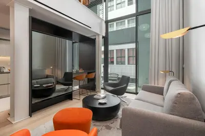 a living room with a couch and chairs at Savoy Insular Loft by An Island Apart in Funchal