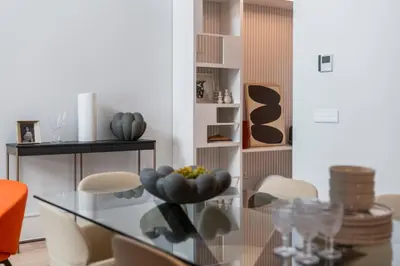 a dining room with a glass table and chairs at Savoy Insular Loft by An Island Apart in Funchal