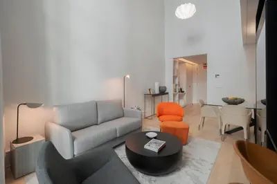 a living room with a couch and a table at Savoy Insular Loft by An Island Apart in Funchal