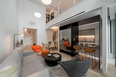 a living room with a couch and a table at Savoy Insular Loft by An Island Apart in Funchal