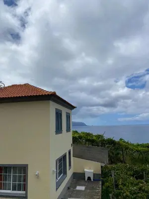 a building with a view of the ocean at Ocean Guest House in São Vicente