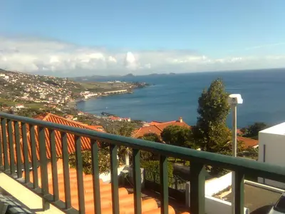 a view of the ocean from a balcony of a house at Residencia ANA Piso Um 1 in Santa Cruz
