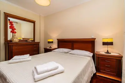 a bedroom with a large bed with two towels on it at Vila do Conde Nº1 in Ribeira Brava