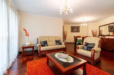 a living room with two chairs and a coffee table at Vila do Conde Nº1 in Ribeira Brava