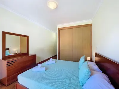 a living room with a couch and a table at Agostinho Apartment by Atlantic Holiday in Santa Cruz