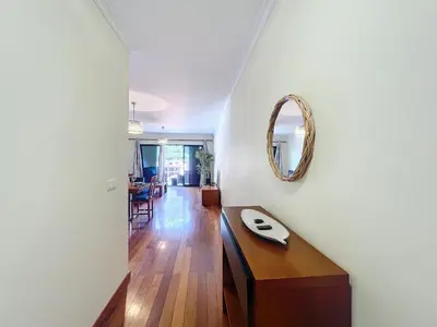 a dining room and living room with a table and chairs at Agostinho Apartment by Atlantic Holiday in Santa Cruz