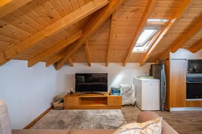 a living room with a couch and a table at Salsa Country House I in Porto Moniz
