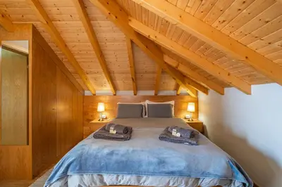 a bedroom with a bed with two pillows on it at Salsa Country House I in Porto Moniz