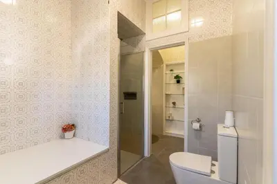 a bathroom with a toilet and a shower at Só Espeto Accommodation Rooms in Santa Cruz
