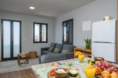 a living room with a table with food on it at Salsa Country House II in Porto Moniz
