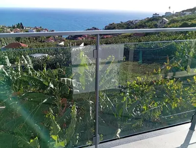 a balcony with a view of the ocean at Holiday House Caetano in Ponta do Sol
