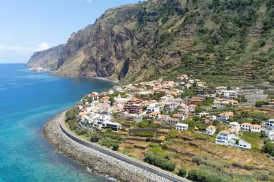 an aerial view of a village on a hill next to the ocean at CasaMar in Jardim do Mar