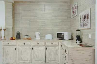 a kitchen with a counter top with a microwave at Host Albina in Funchal