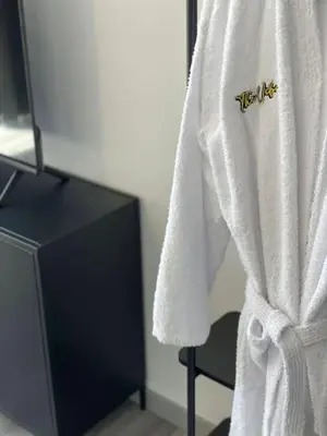 a white towel with the word hello on it at The Vibe Madeira Apartment 2 in Arco da Calheta