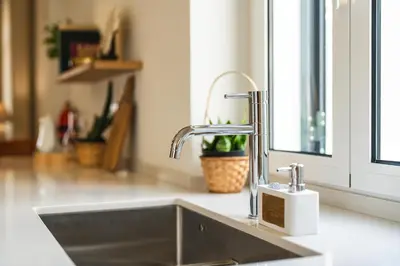 a kitchen sink with a faucet next to a window at Luxury Retreat in Camara de Lobos in Câmara de Lobos