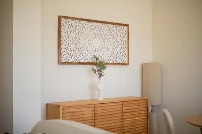a picture hanging on a wall above a dresser at Pontalaia Atlantic View in Sagres