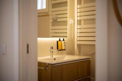 a bathroom with a sink and a mirror at Pontalaia Atlantic View in Sagres