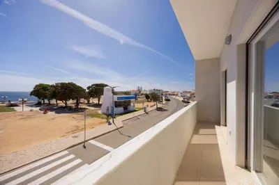 a balcony of a building with a view of the ocean at Pontalaia Ocean View in Sagres