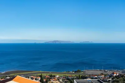 an aerial view of the ocean with houses and buildings at Casa Carlota by Atlântica in Santa Cruz