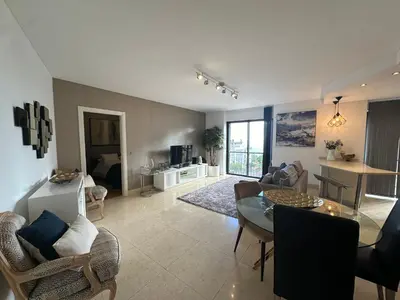 a large living room with a table and chairs at Sunset Sea View in Funchal