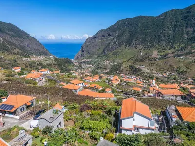 an aerial view of a village with mountains at Landure by Homie in São Vicente