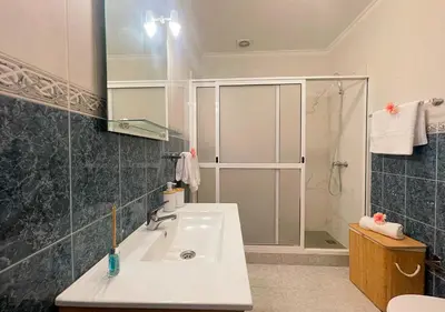 a bathroom with a sink and a shower at Villa Nunes in Funchal