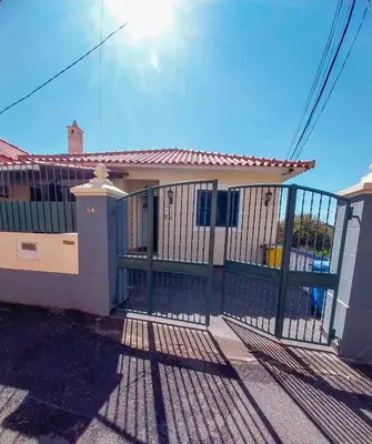 a gate in front of a house at Villa Nunes in Funchal