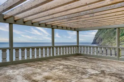 an empty porch with a view of the ocean at Casa da Rocha by Pleasantconcept in Santana