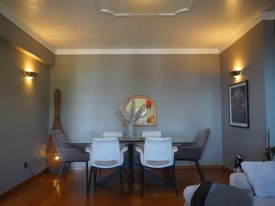 a dining room with a table and chairs at Camacho Residence in Funchal
