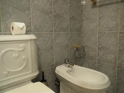 a bathroom with a toilet and a sink at Camacho Residence in Funchal